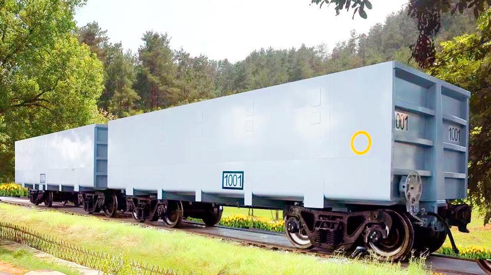 Rail mining truck with polyurea abrasion resistant lining