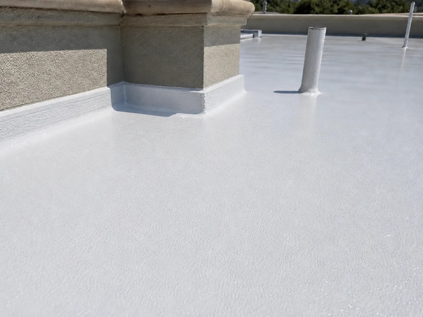 Finished detail of BW0-8029 weather-resistant polyaspartic protective topcoat around roof penetrations