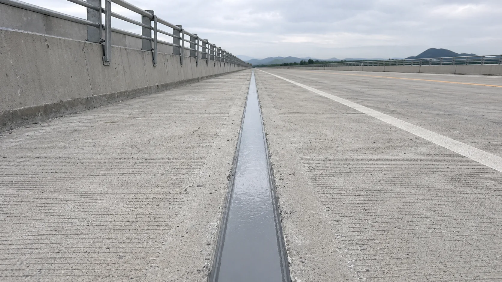 BW6-189 polyurea concrete joint sealant applied in an outdoor concrete expansion joint