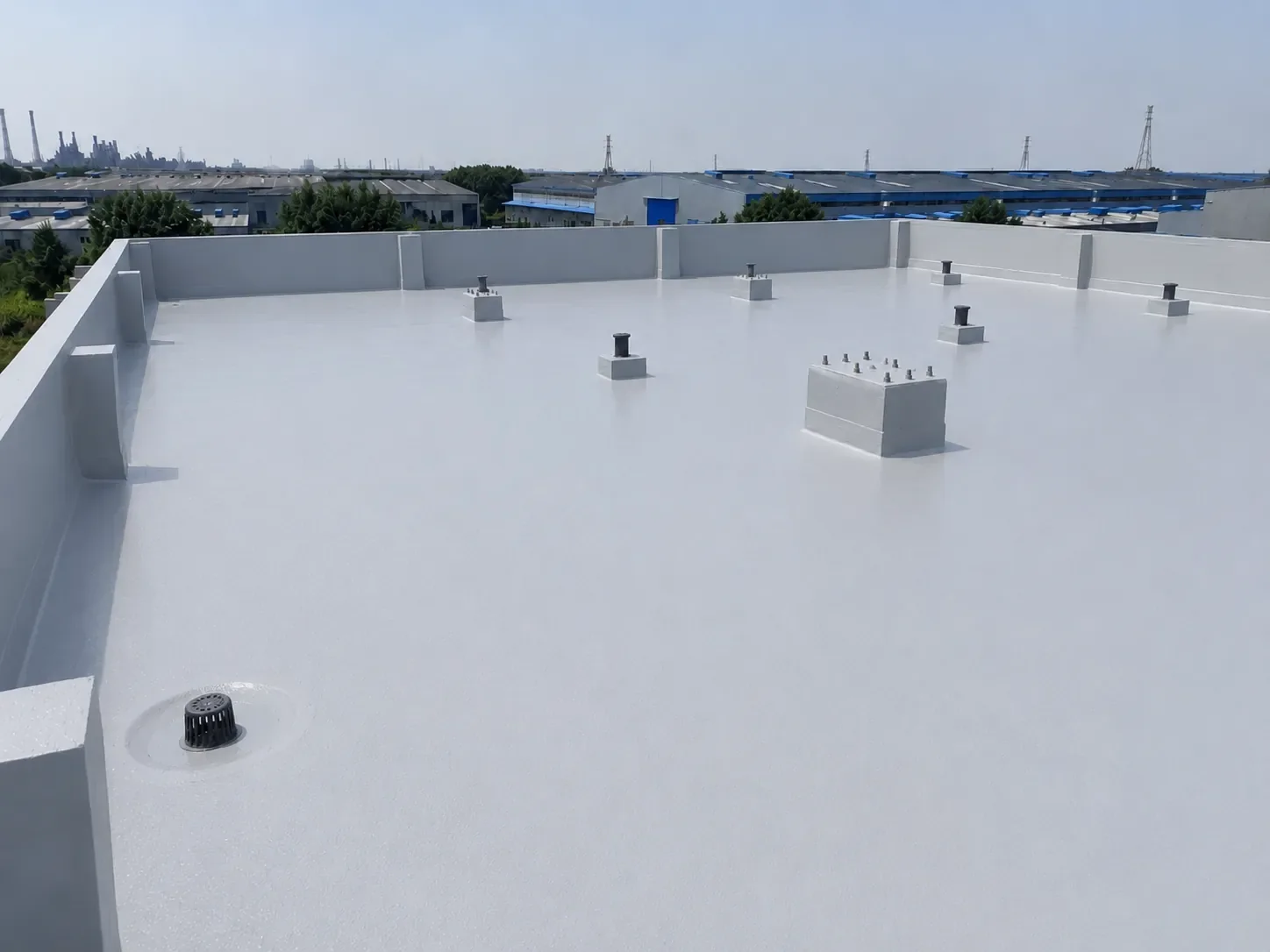 BW0-8029 exposed polyaspartic concrete roof topcoat over hand-applied polyurea membrane