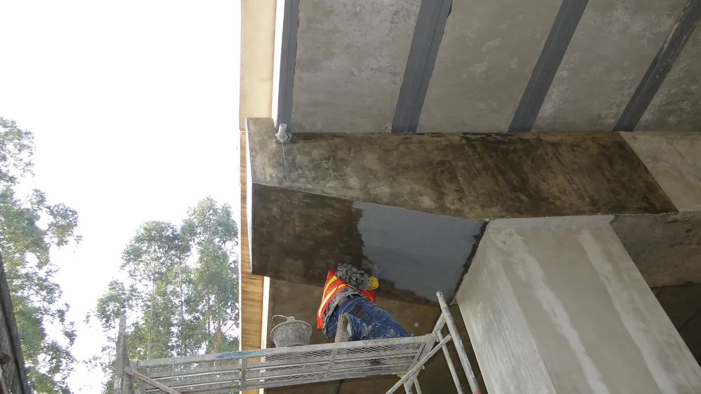 Bridge local repair area with hand-applied polyurea waterproofing layer