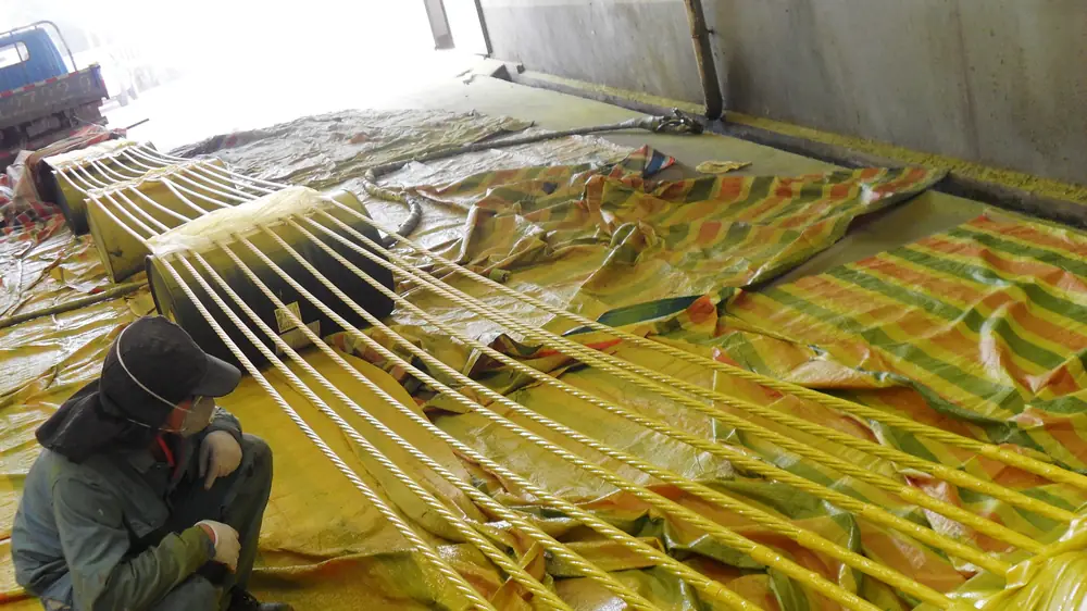 Bridge steel strand coated with spray polyurea protective system