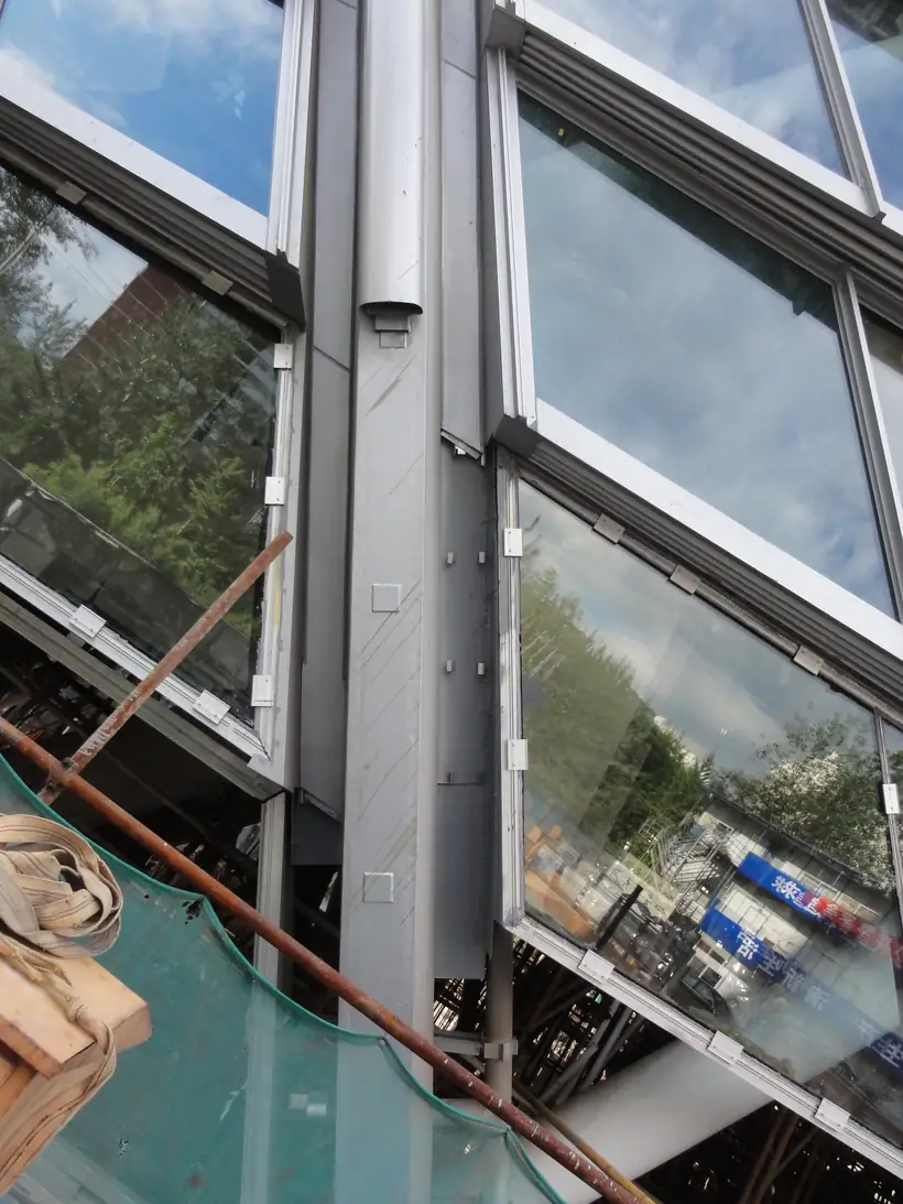 Close-up of coated architectural steel frame and window support details