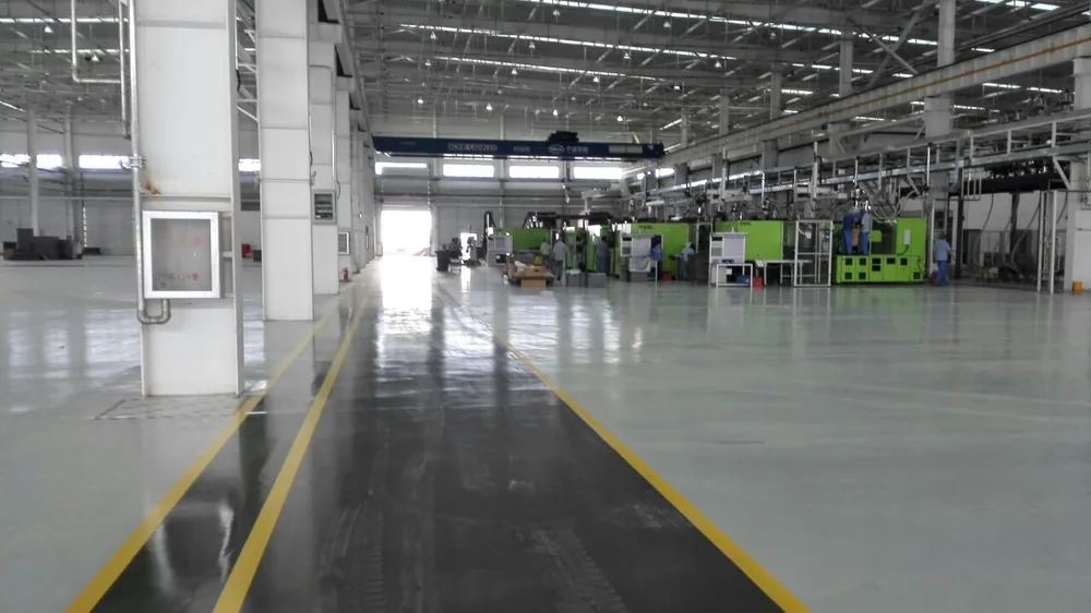 Automotive parts production workshop floor with polyurea protective coating