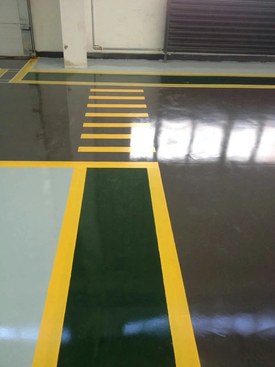 Large manufacturing workshop floor with wear-resistant coating system