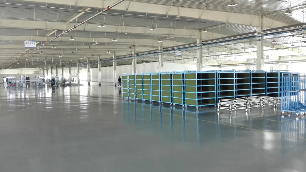 Finished white equipment area floor coating in automotive workshop