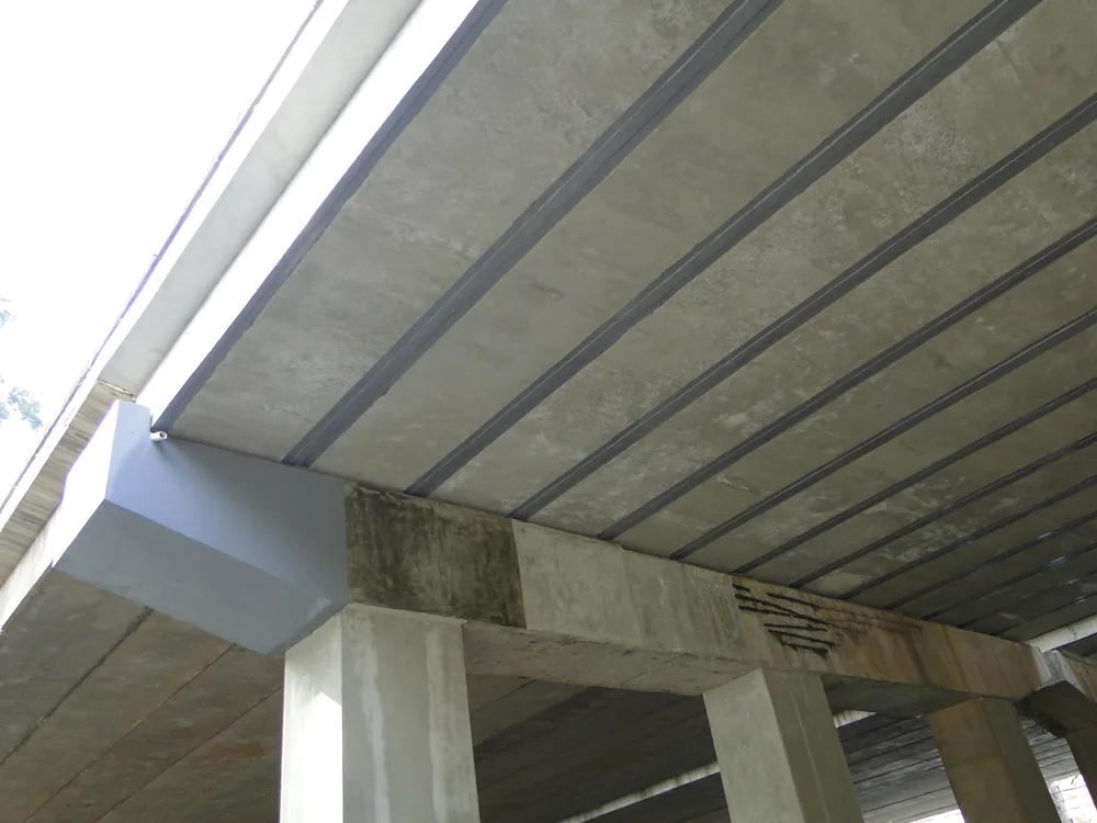 Finished bridge beam underside with local repair coating protection