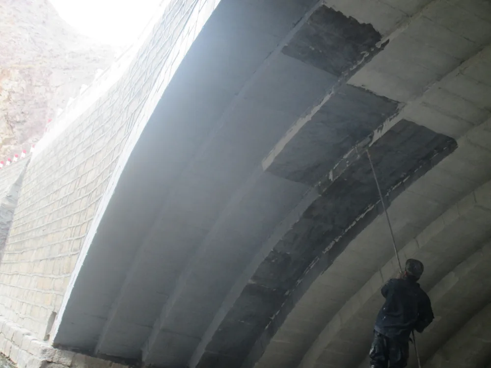 Bridge beam underside waterproofing repair detail with reinforced coating