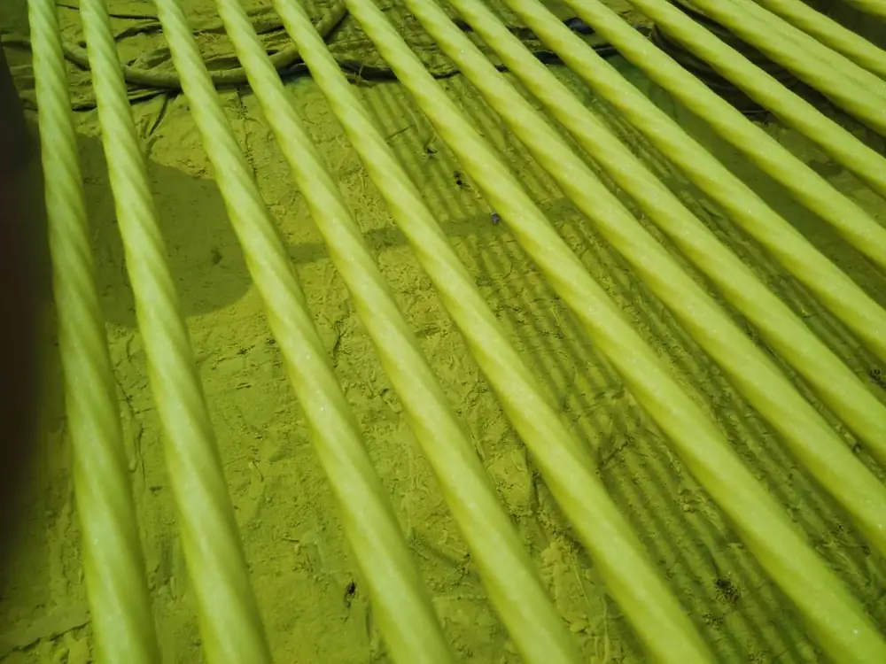 Yellow protective coating applied on bridge steel strand