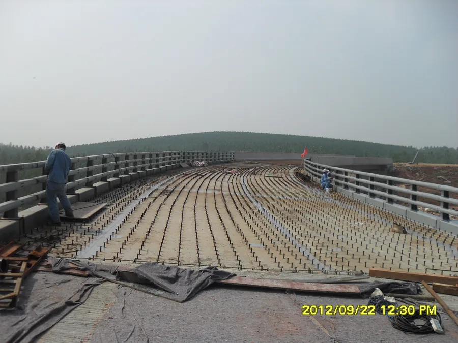 Curved bridge guardrail section during anti-corrosion protection work