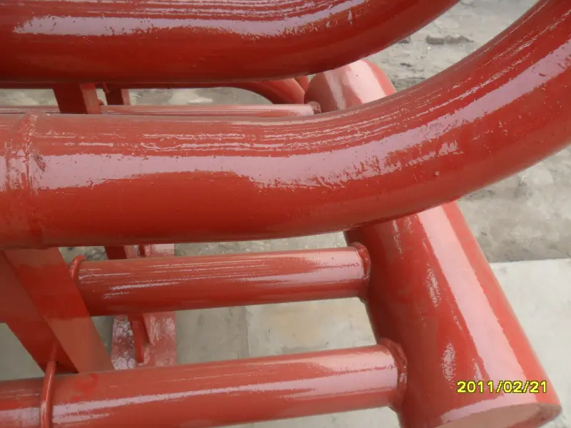 Finished red protective coating on cooling water discharge pipe bend