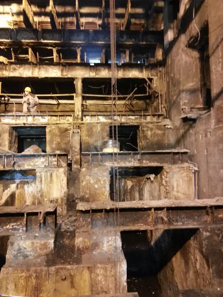 Weathered industrial steel structure before anti-corrosion coating renovation