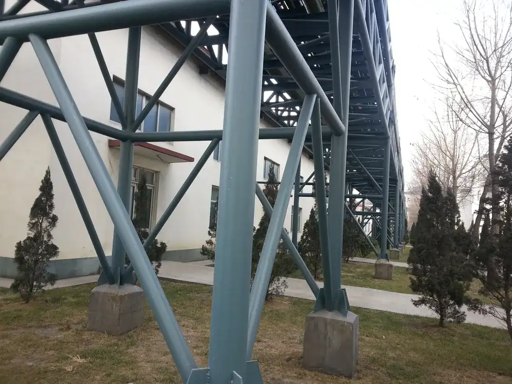 Coated steel support frame and pipe rack in industrial facility