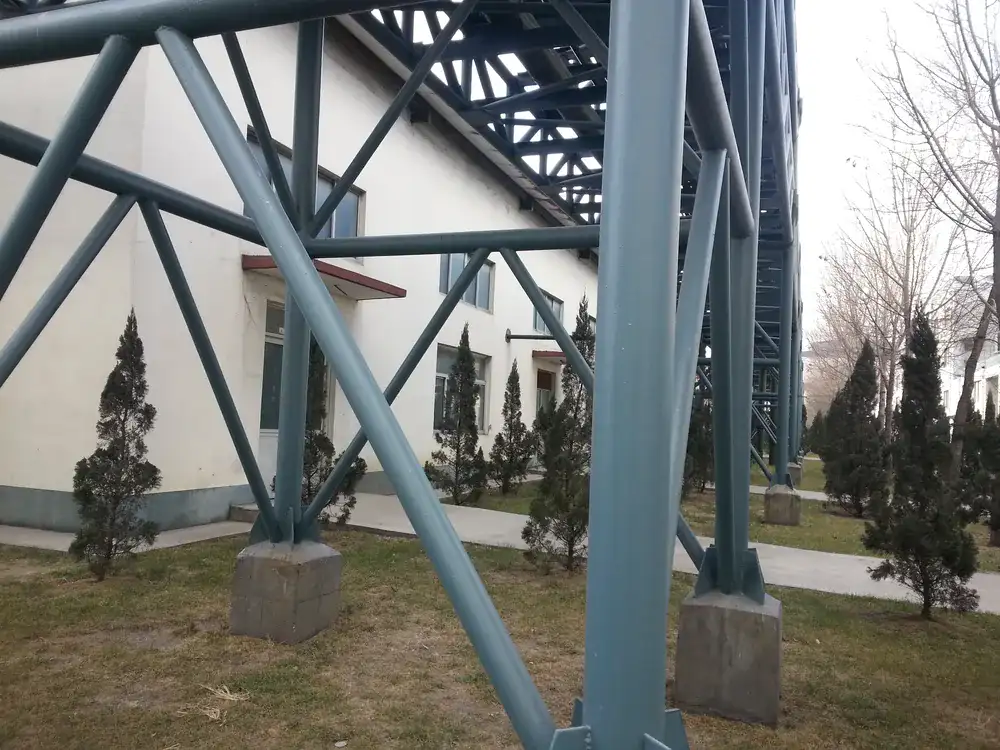 Exterior steel columns and braces with protective topcoat