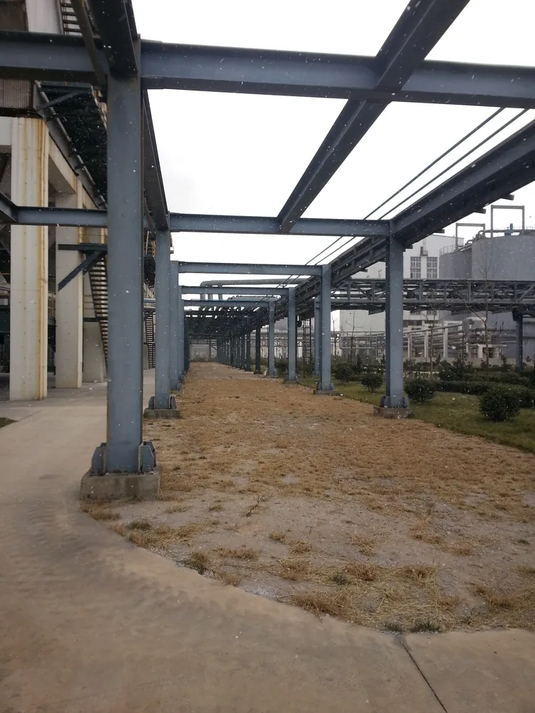 Industrial steel pipe rack corridor with protective coating