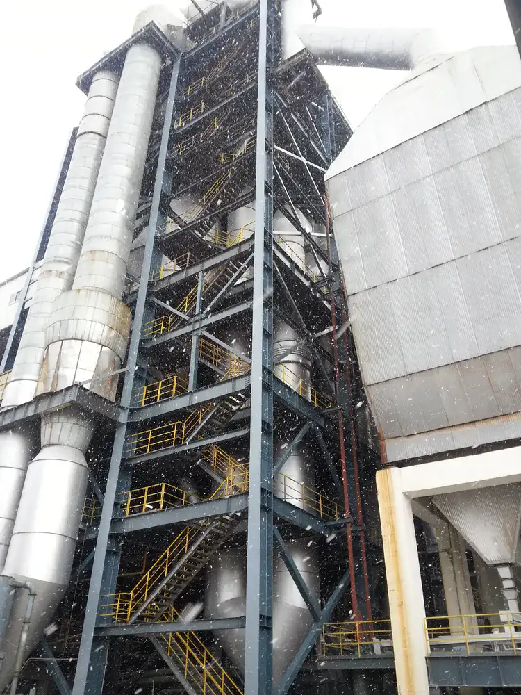 Tall industrial steel structure with exterior anti-corrosion coating