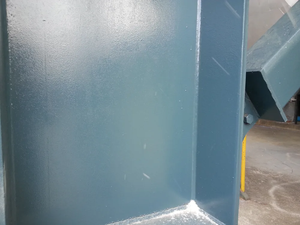 Coated steel structure detail around column and support connection