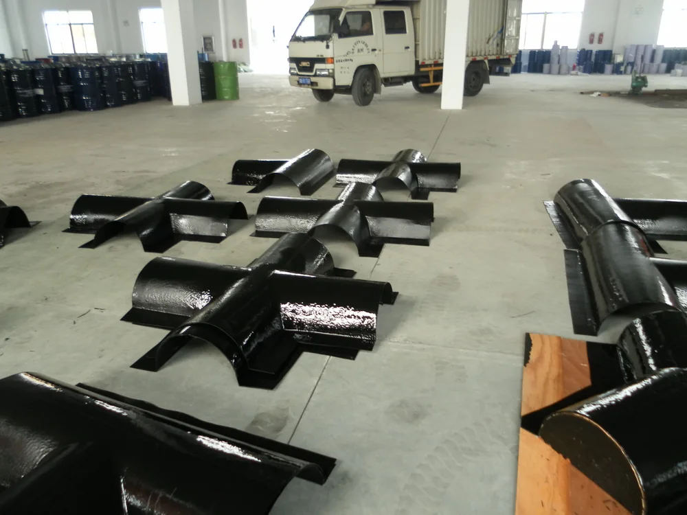 Finished black spray polyurea coating on hydraulic steel equipment parts