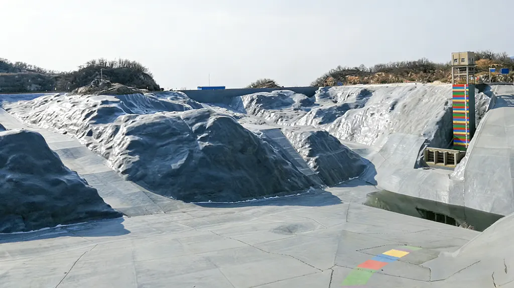 Large reservoir sloped concrete surface with waterproofing membrane areas