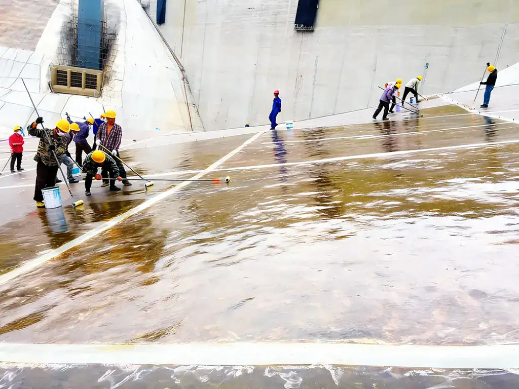 Field team working on reservoir waterproofing detail area