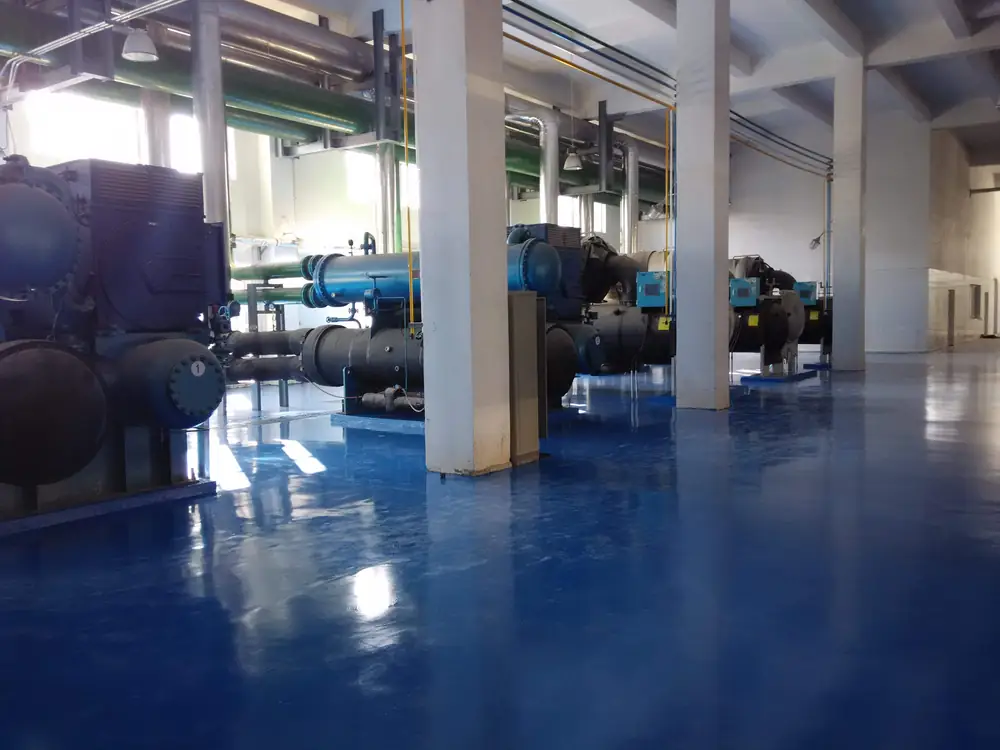 Cleanable industrial floor coating around pharmaceutical equipment area