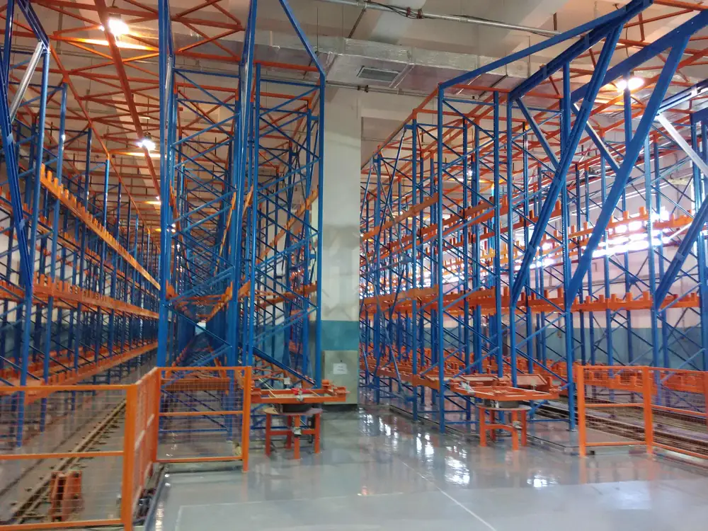 Pharmaceutical warehouse floor with rack system and protective coating