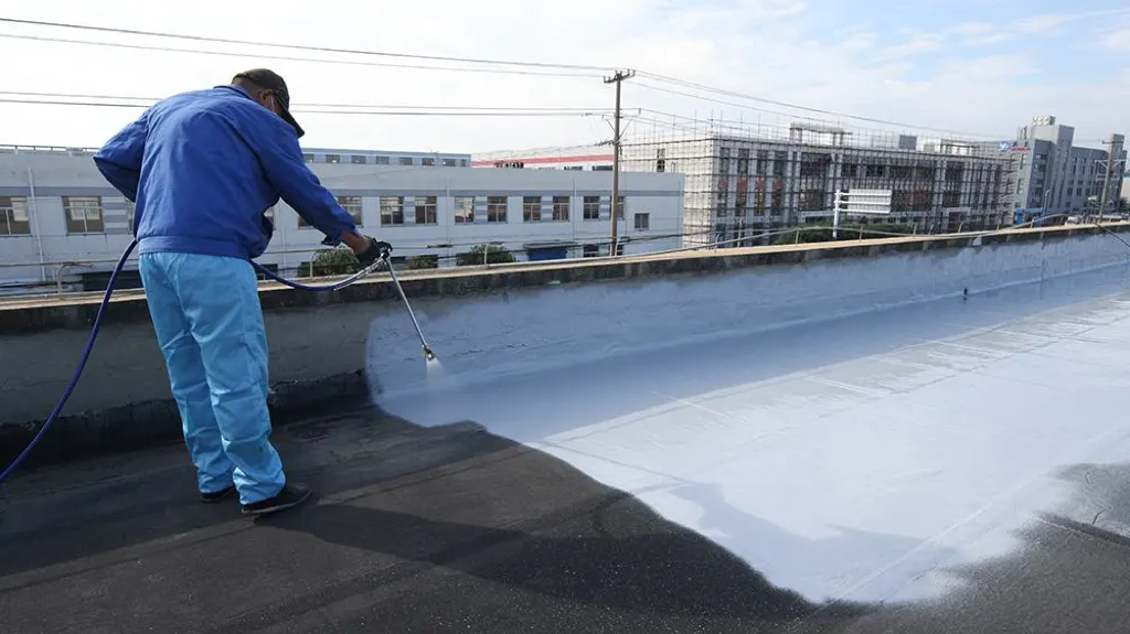 Hand-applied polyurea waterproofing coating on aged roof surface