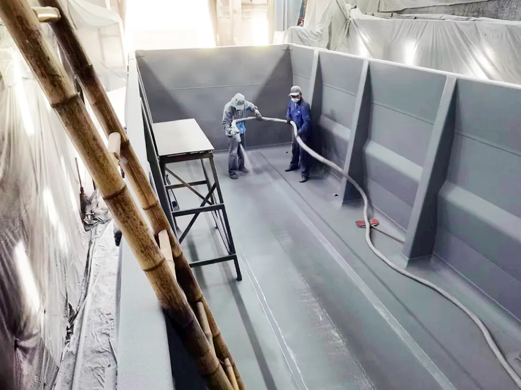 Spray polyurea coating application process inside mining truck bed