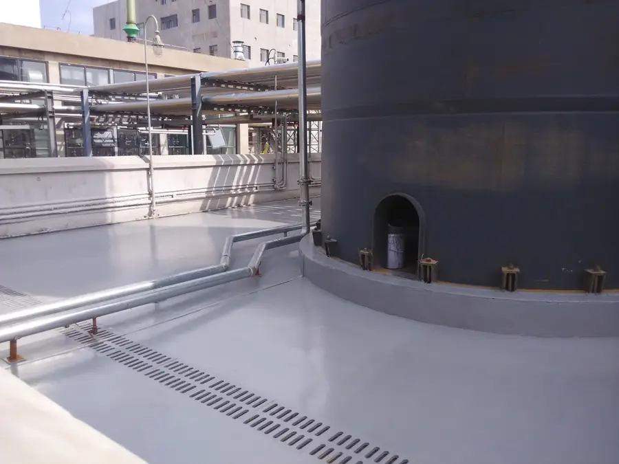 Industrial floor coating around tank bases and equipment supports