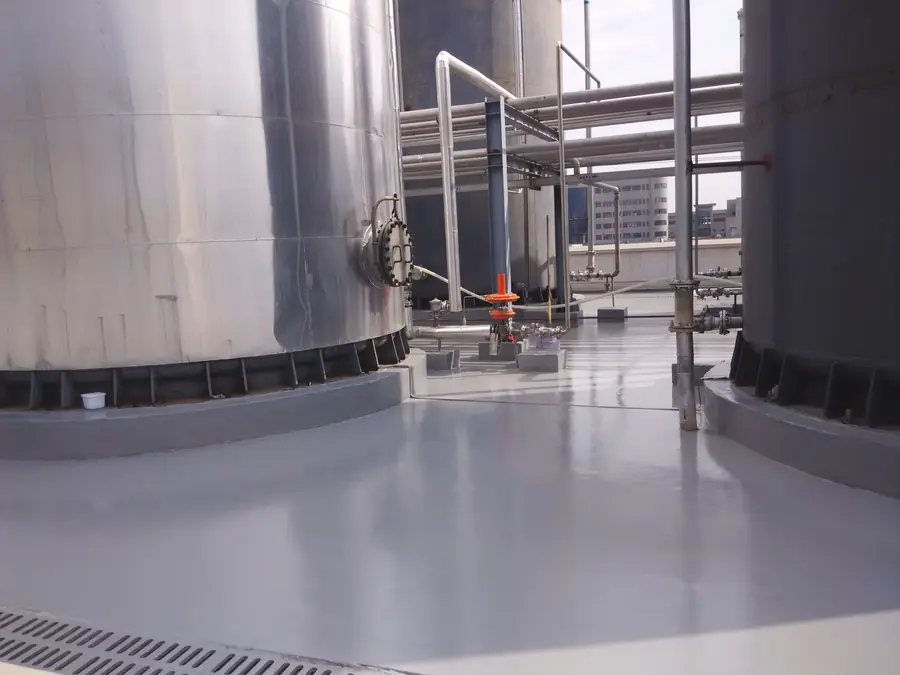 Finished protective floor coating in outdoor industrial tank area