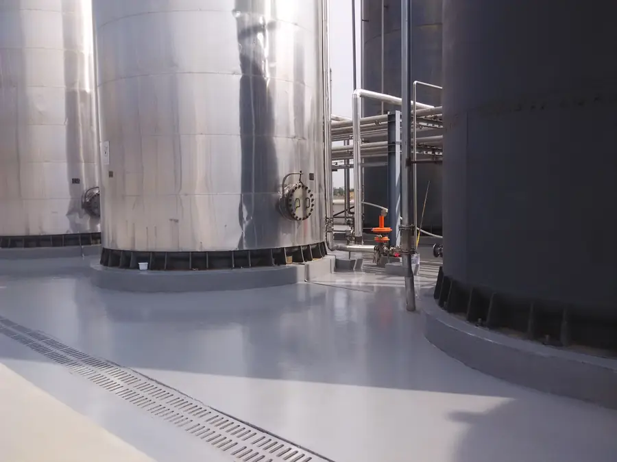 Outdoor anti-corrosion floor surface with pipe and drainage details