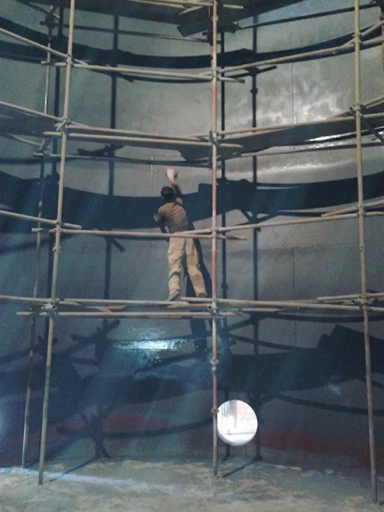 Internal storage tank coating work with scaffolding