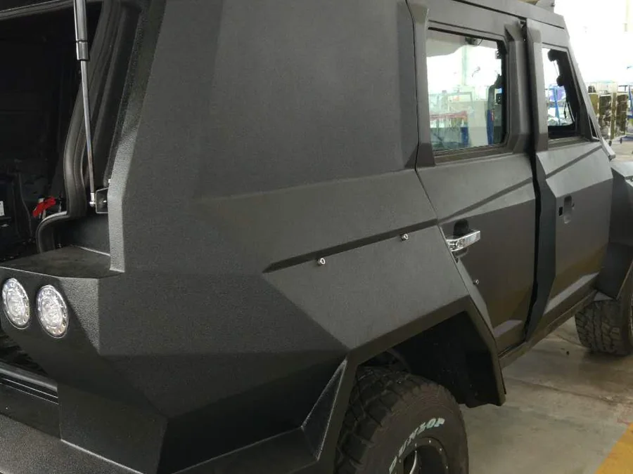 Matte textured protective coating on riot control vehicle exterior body panels