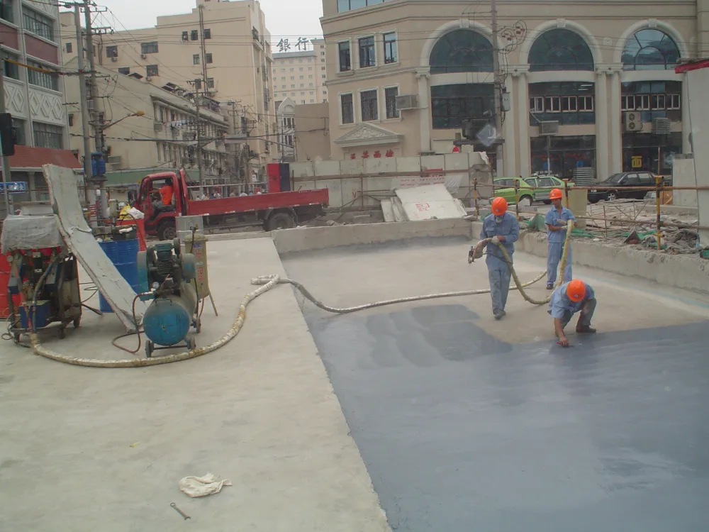 Workers applying spray polyurea waterproofing on Shanghai Bund tunnel top slab