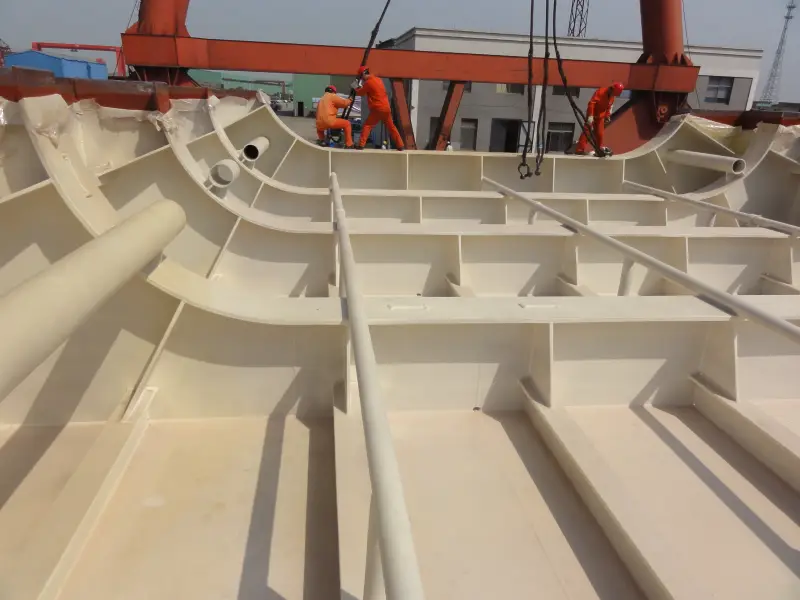 Curved marine steel compartment section with spray polyurea coating