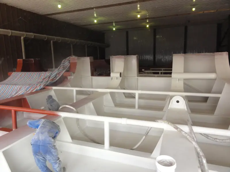 Spray polyurea application inside internal ship steel compartment