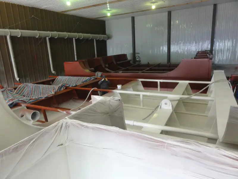Marine internal steel structure with masked areas and protective coating work