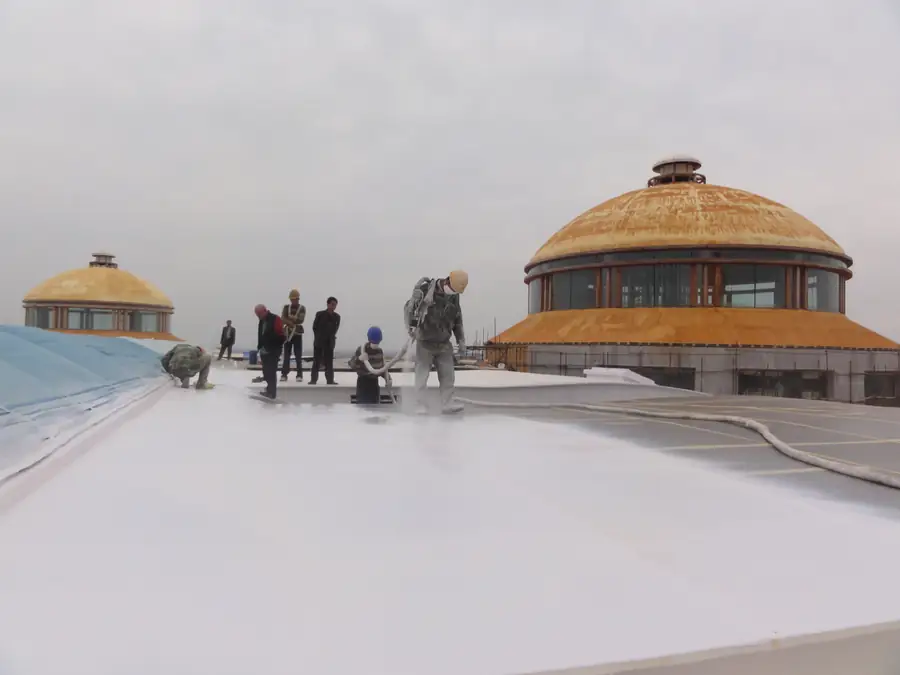 Dome building roof area protected with spray polyurea waterproofing system