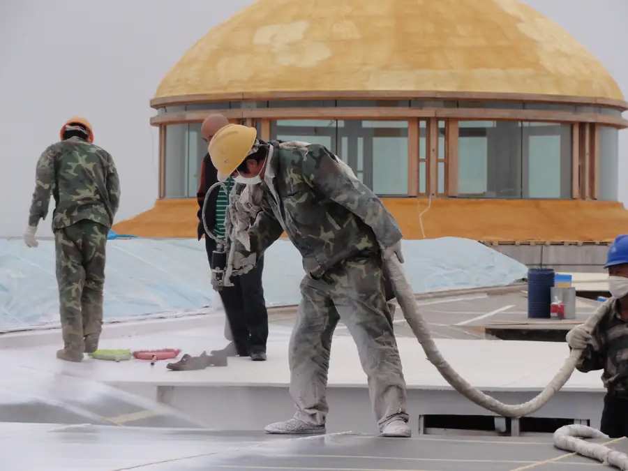 Roof detail area with spray polyurea membrane around openings and transitions