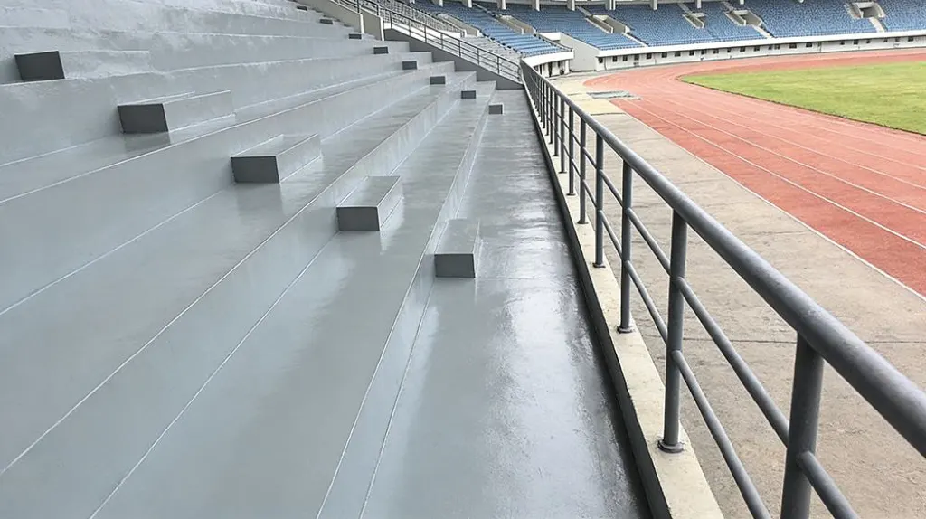 Spray polyurea application on stadium concrete stand surface
