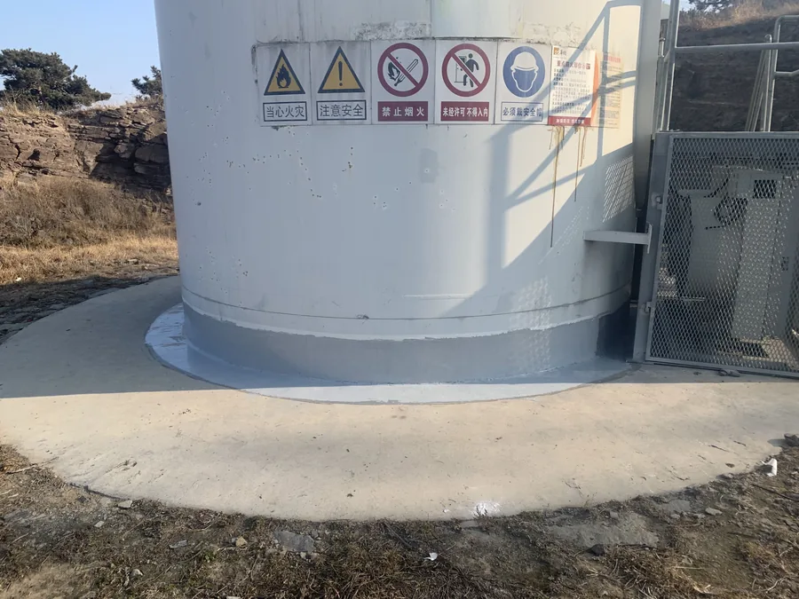 Circular wind turbine foundation edge with hand-applied polyurea protective coating